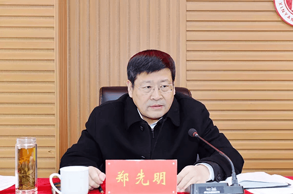 郑先明，主动投案
